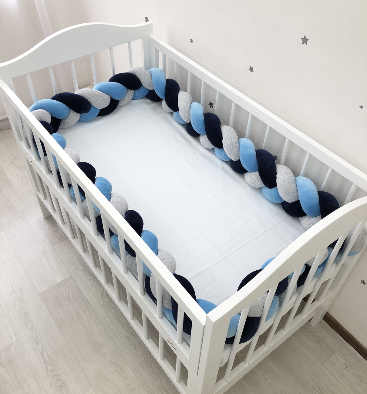 Braided bumper cot. 3-strand knot bumper for the cradle